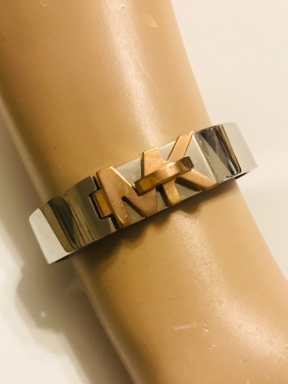 Michael Kors Silver Tone Hinged Bracelet With Gold Tone MK Logo